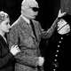 The Invisible Man Returns! That’s him in the glasses.
